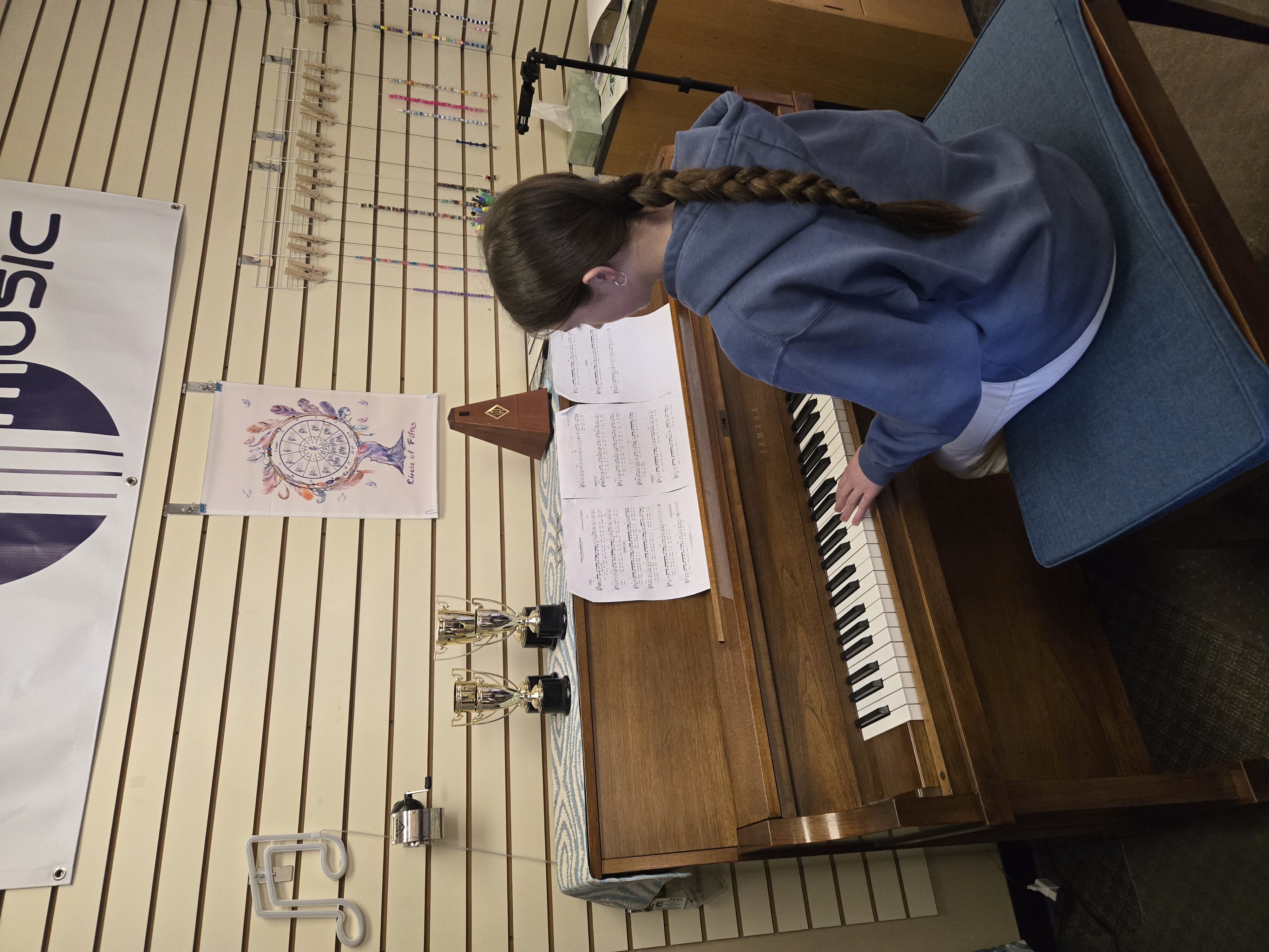 Teacher working one-on-one with a piano student